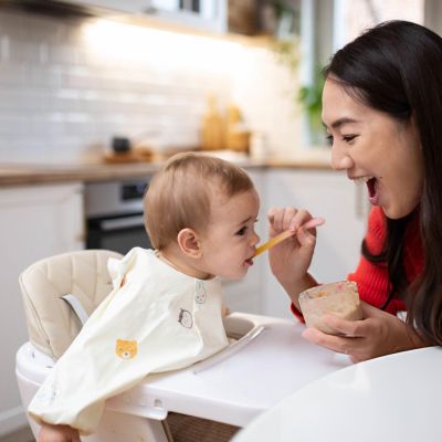 Family-life.-Mother-feeding-her-baby-at-home.jpg